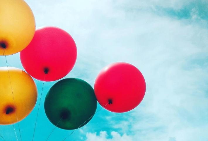 Colourful balloons in a blue sky